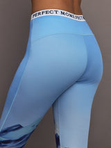 Close up of Printed Base Layer Leggings in Ski Lift Blue showing Perfect Moment logo waistband.
