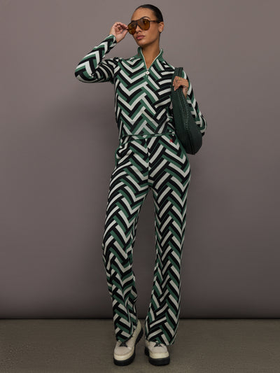 Full body view of model styled in LA Tour Merino Wool Quarter Zip Sweater with matching knit pants in green waffle print.