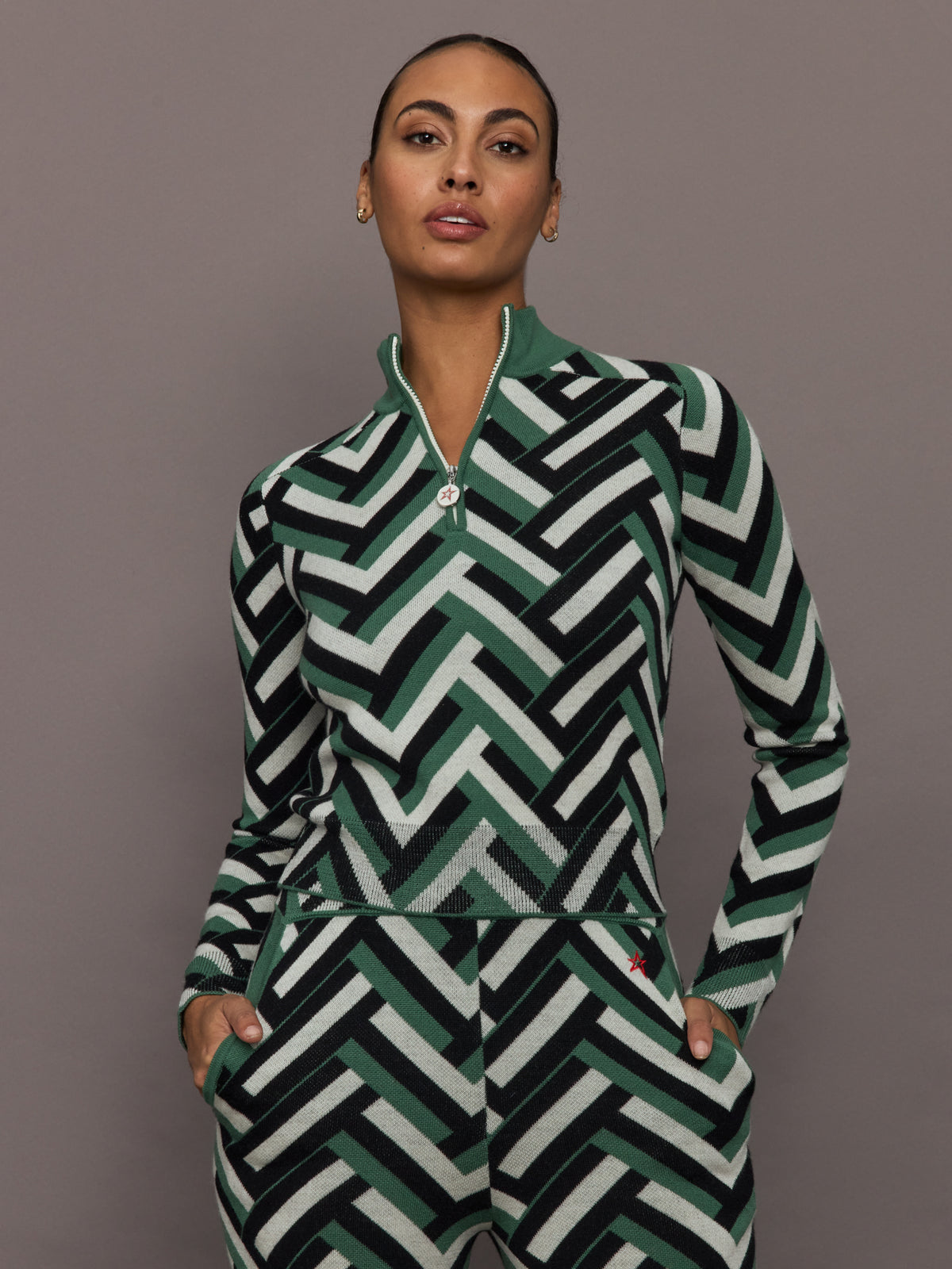 Front view of model wearing LA Tour Merino Wool Quarter Zip Sweater in green waffle print.