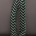 Front view of model wearing Chalet Merino Wool Knitted Pant in green waffle print.