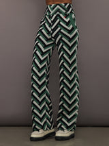 Front view of model wearing Chalet Merino Wool Knitted Pant in green waffle print.