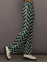 Side profile of Chalet Merino Wool Knitted Pant in green waffle print with relaxed wide leg fit.