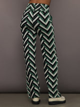 Back view of Chalet Merino Wool Knitted Pant in green waffle print with high rise waistband.