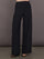 Model is wearing Palazzo Pant in Melt in black, front full length view with wide leg silhouette and high rise waistband.