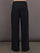 Model is wearing Palazzo Pant in Melt in black, back view showcasing wide leg shape and clean waistband construction.