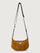 Brown shoulder bag with a black strap on a light gray background