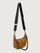 Brown shoulder bag with black strap and chain detail on a light gray background