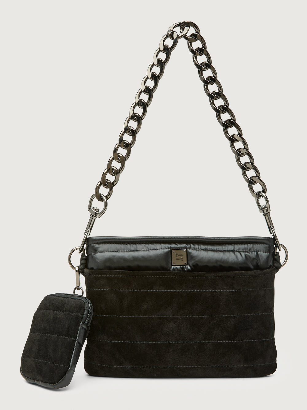 Black handbag with chain strap on a light gray background