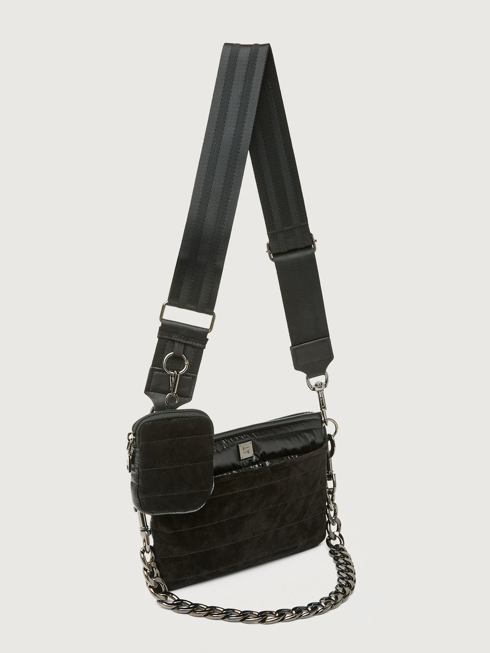 Black textured handbag with a chain detail on a light gray background