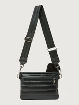 Black leather crossbody bag with a strap on a light gray background
