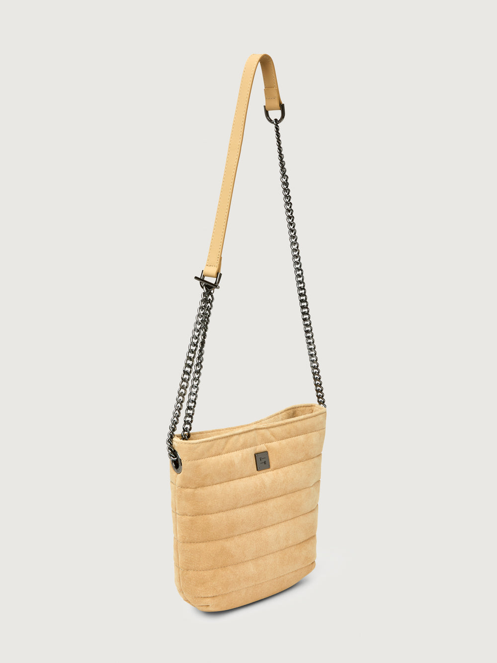 Side view of the Light Beige suede crossbody bag with chain strap.