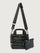 Black leather handbag with matching wallet on a light gray background