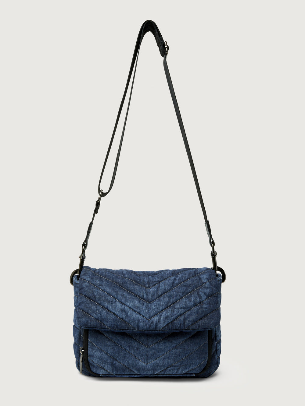 The Muse in Stone Washed Denim, front view with crossbody strap extended.