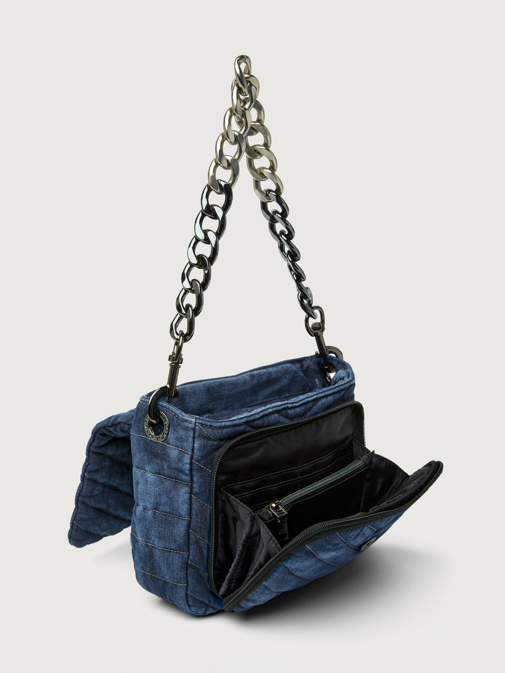 The Muse in Stone Washed Denim, angled view with interior compartments open.