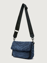 The Muse in Stone Washed Denim, angled front view with long crossbody strap.