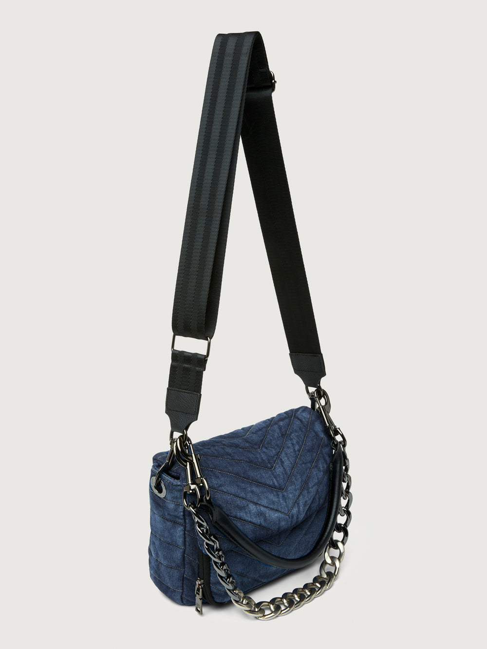 The Muse in Stone Washed Denim, angled view with chain handle and crossbody strap.