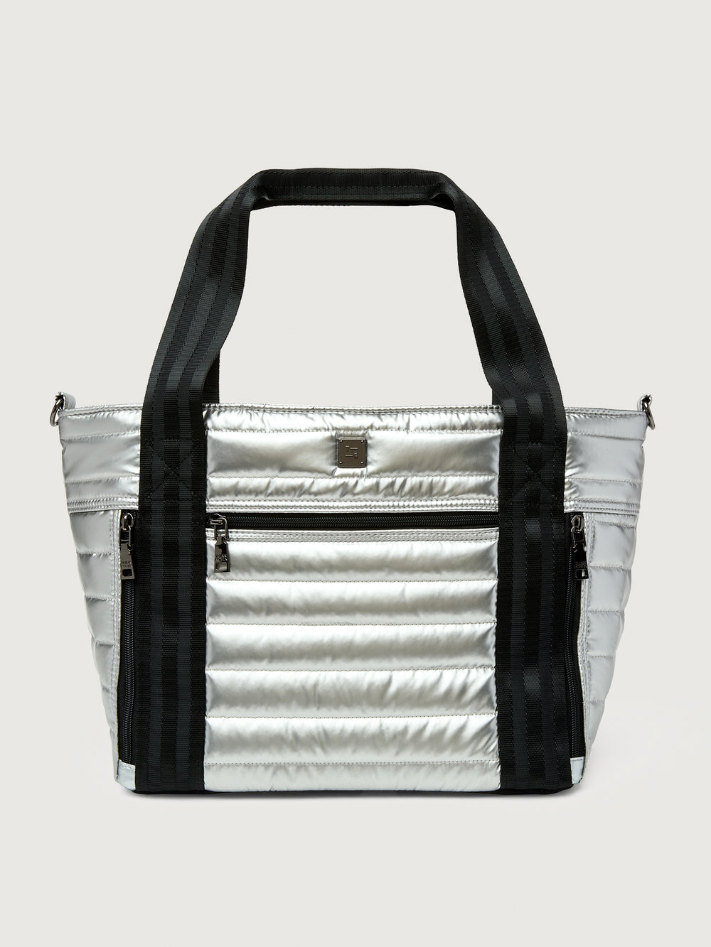 Silver insulated tote bag with black handles on a light gray background