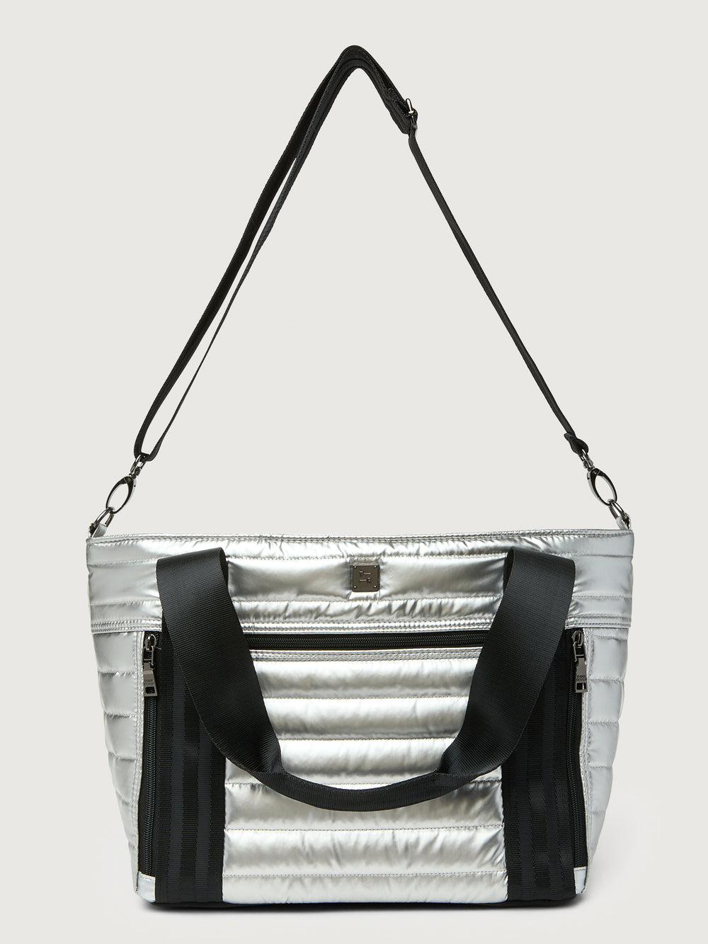 Silver insulated tote bag with black handles on a light gray background