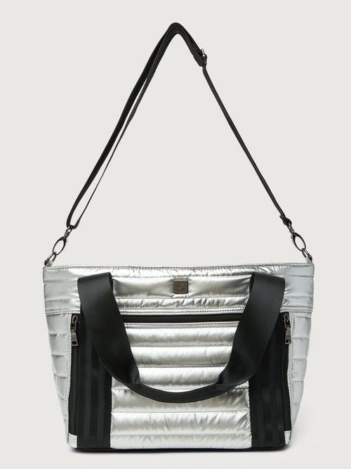 Silver insulated tote bag with black handles on a light gray background