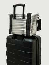 Silver insulated tote bag with black handles on a light gray background