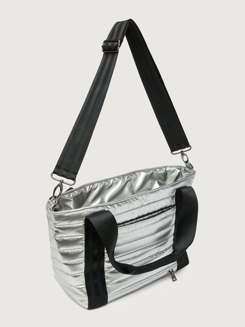 Silver insulated tote bag with black handles on a light gray background