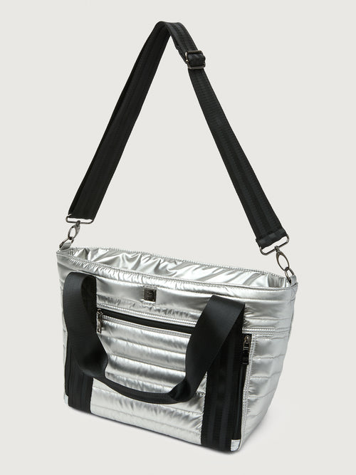 Silver insulated tote bag with black handles on a light gray background