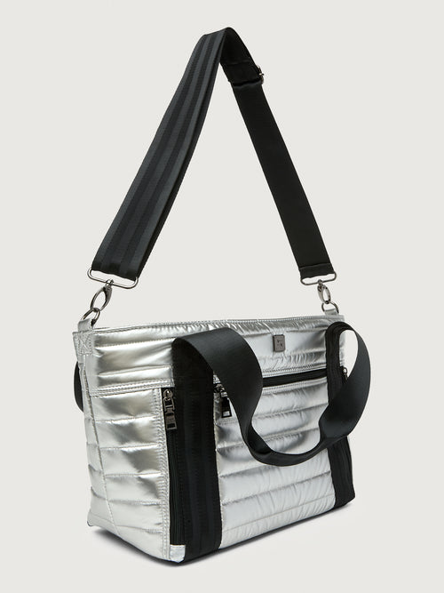 Silver insulated tote bag with black handles on a light gray background