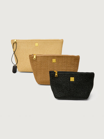 Travel Trio in Dune Raffia, angled front view of all three pouches.