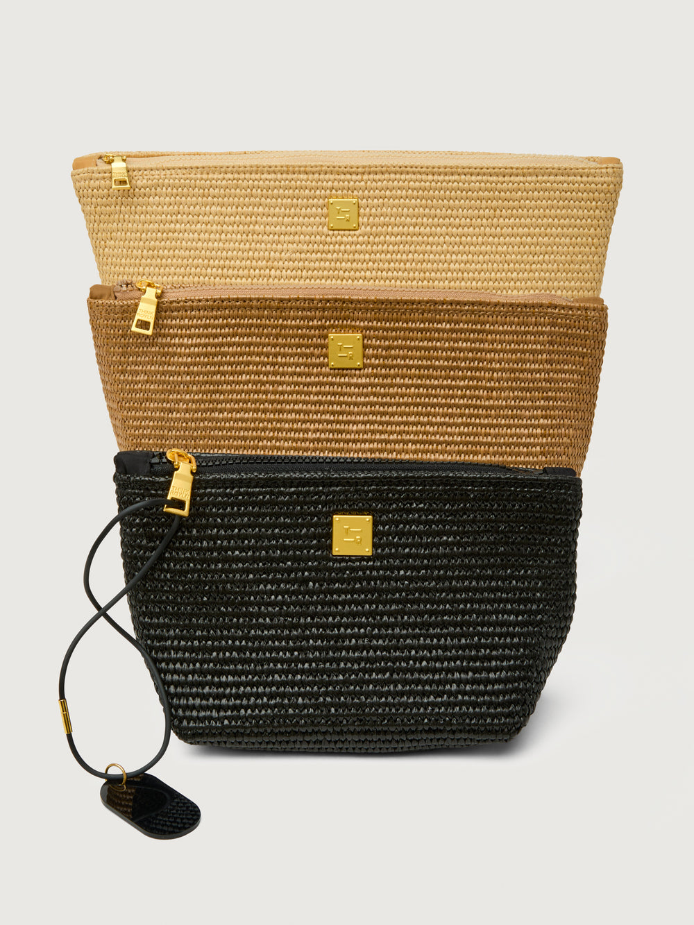 Travel Trio in Dune Raffia, pouches shown in ascending size front view.