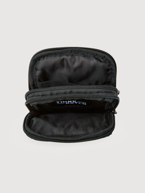 Open interior of leopard print crossbody bag showing lined compartments with zip closure.