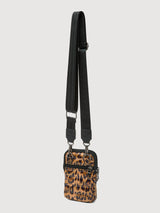Side view of leopard print puffer crossbody bag with black strap and zip compartments.