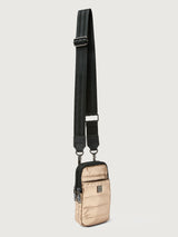 Beige crossbody bag with a black strap on a light gray background