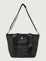 Back view of Think Royln Capri tote in black with long crossbody strap attached.