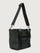 Side angle of Think Royln Capri black tote with adjustable crossbody strap and short top handles.