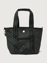 Close-up front angle of Think Royln Capri black tote with striped webbing straps and adjustable shoulder strap.