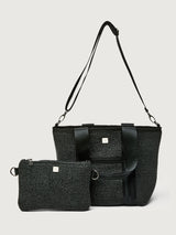 Back view of Think Royln Capri black tote with long crossbody strap and detachable black pouch.