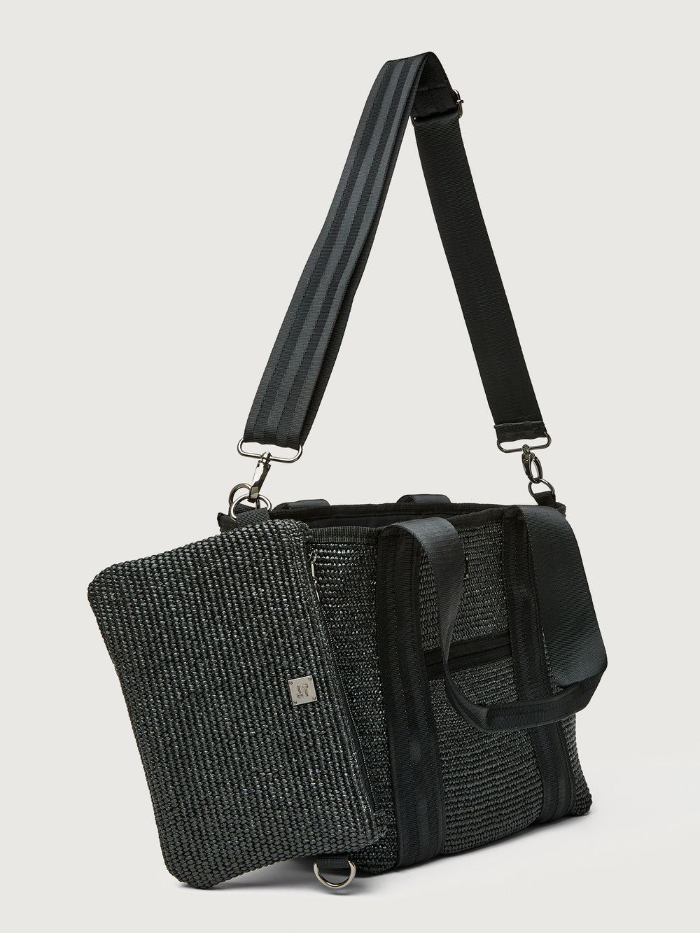 Side angle of Think Royln Capri tote with detachable black pouch clipped to bag.