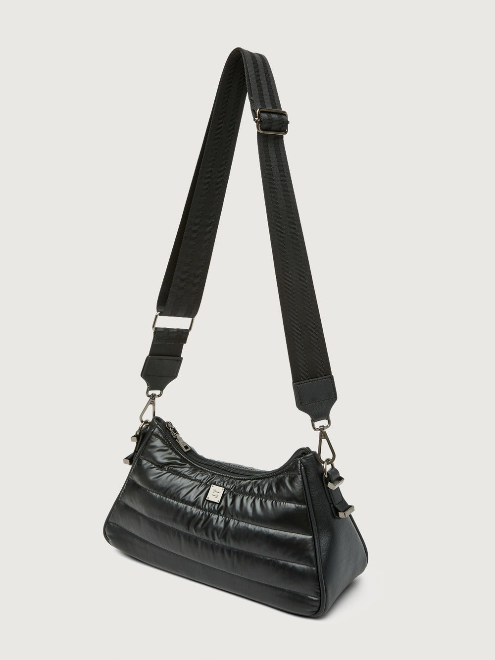 Pearl Black shoulder bag with web strap, three-quarter back view.