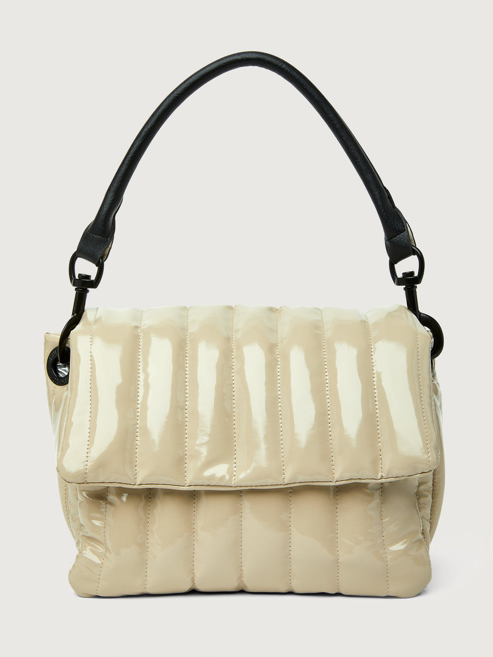 Beige handbag with black handle on a light gray background