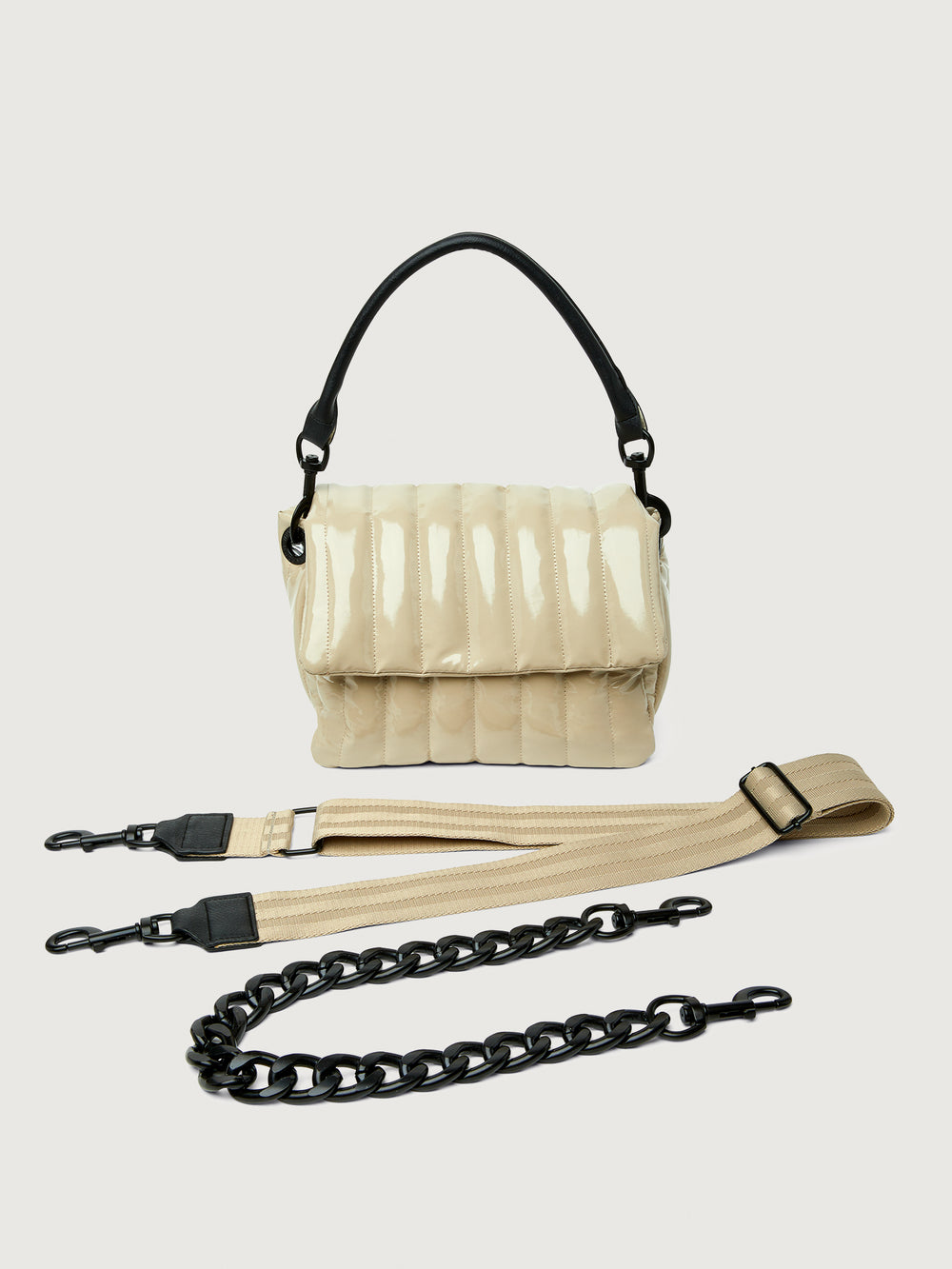 Beige handbag with black handle on a light gray background