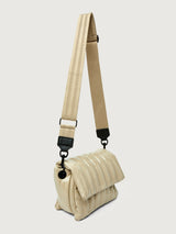 Beige handbag with black handle on a light gray background