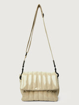 Beige handbag with black handle on a light gray background