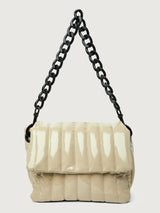 Beige handbag with black handle on a light gray background