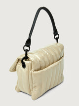 Beige handbag with black handle on a light gray background