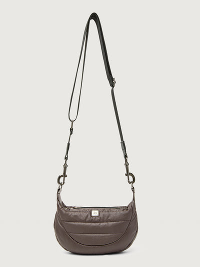 Brown shoulder bag with a strap on a light gray background