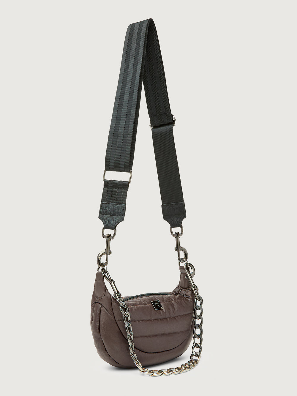 Brown handbag with a black strap and chain detail on a light gray background