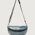 Carbon waist bag with a black strap on a light gray background
