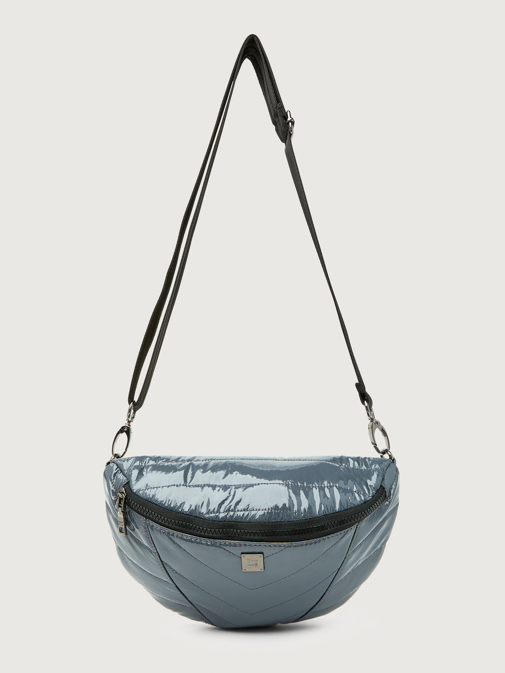 Carbon waist bag with a black strap on a light gray background