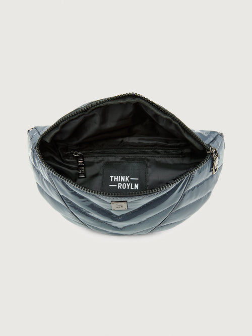 Carbon waist bag with a black strap on a light gray background