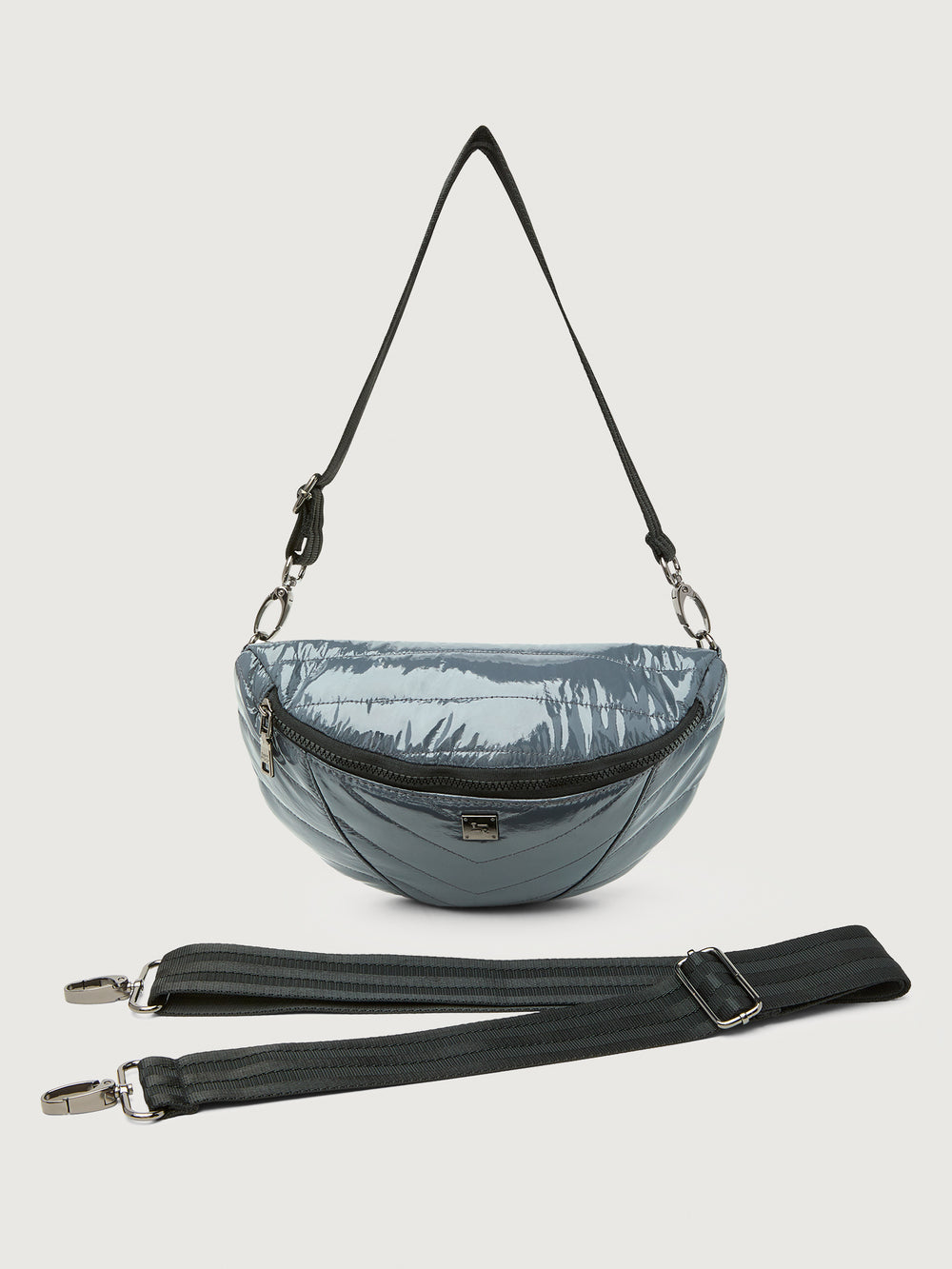 Carbon waist bag with a black strap on a light gray background